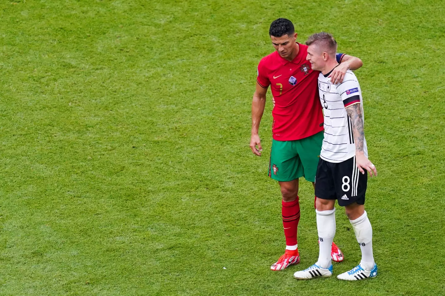 Cristiano Ronaldo and Toni Kroos embrace after an international fixture. Image: Getty